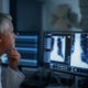 physician examining low-dose CT scan results for early lung cancer detection
