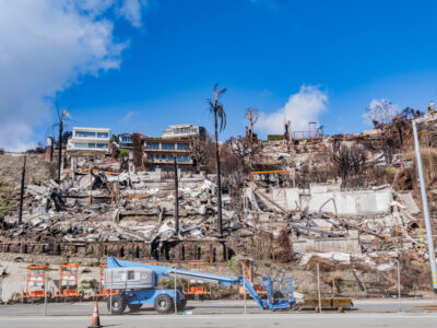 burned home site with protective crews following California wildfire debris cleanup asbestos safety requirements