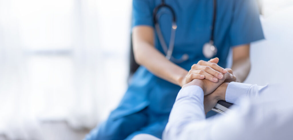 Doctor reviewing mesothelioma treatment options with patient including surgery, chemotherapy, and immunotherapy.