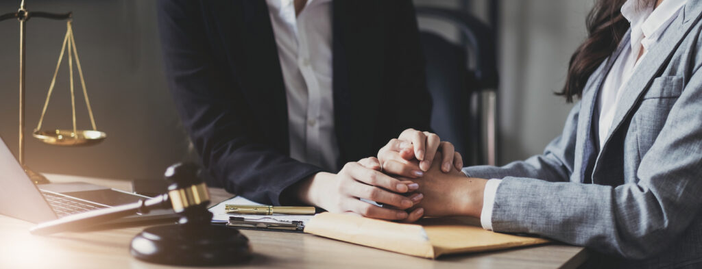 Lawyer discussing mesothelioma legal options with a patient and family