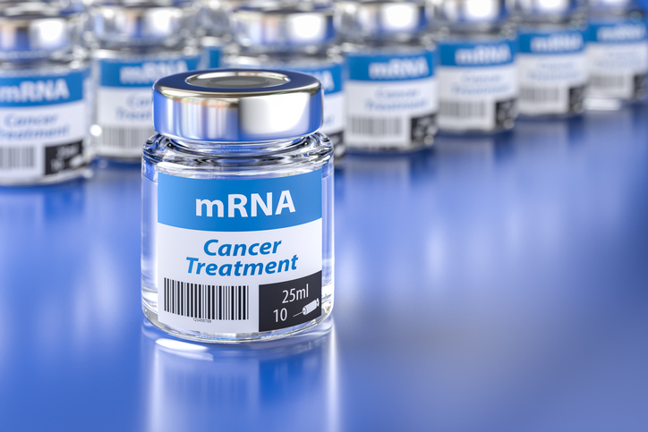 Glass vial labeled mRNA cancer treatment representing universal cancer vaccine development