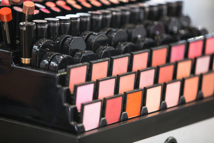 Display of women’s cosmetics and makeup powders highlighting talc safety concerns in Making America Toxic Again article