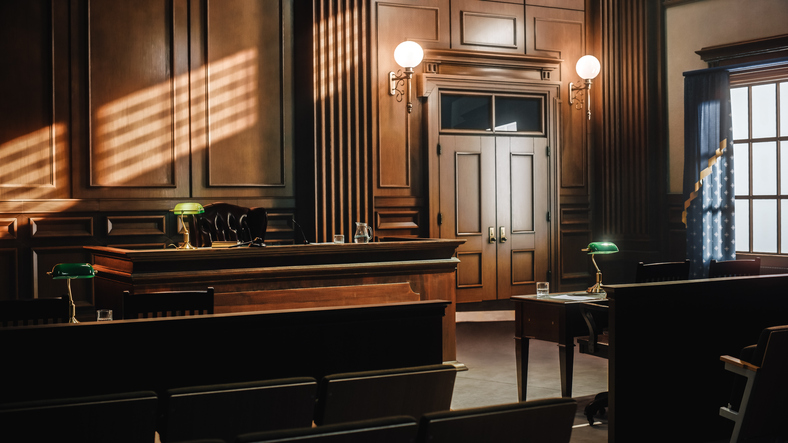 Historic asbestos cases that changed the law courtroom interior with judge bench and dramatic lighting