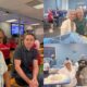 DuBose Law Firm team members packing MannaPack meals on the assembly line at Feed My Starving Children in Richardson, Texas
